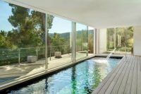 19 long and narrow indoor pool with a wooden deck and views