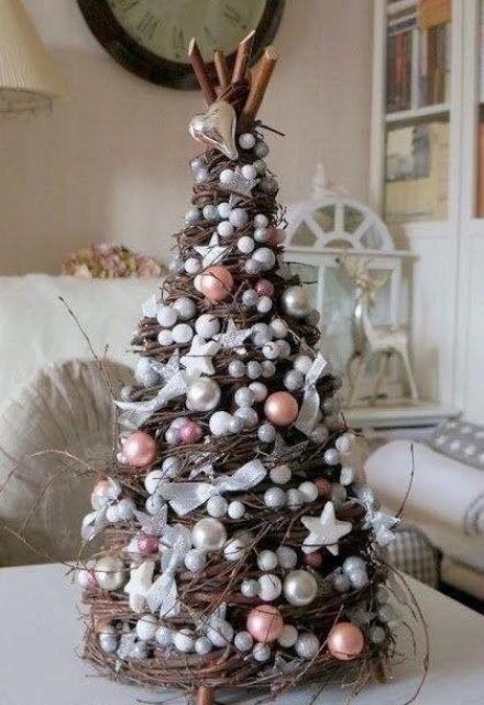 a creative vine tabletop Christmas tree decorated with beads and pearls, with sticks and little hearts and stars