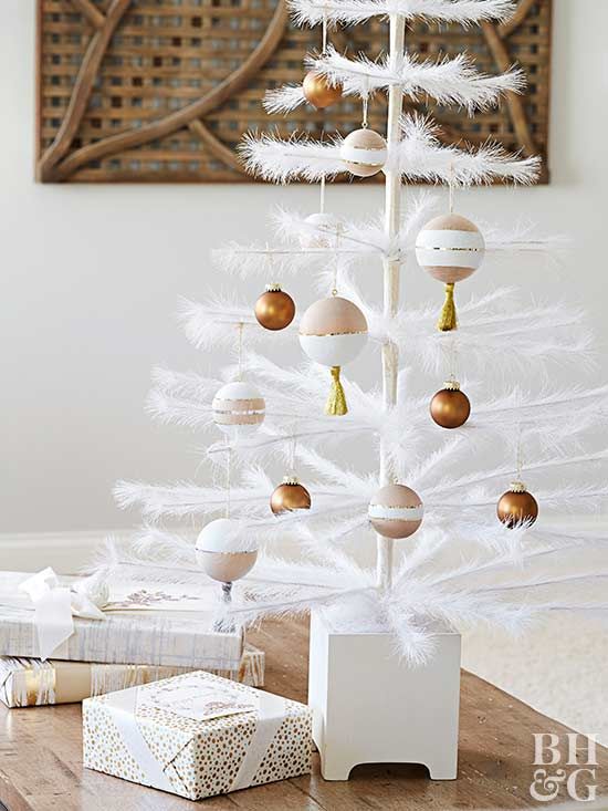 a white tinsel Christmas tree decorated with brown, white and blush ornaments is an ethereal idea to go for
