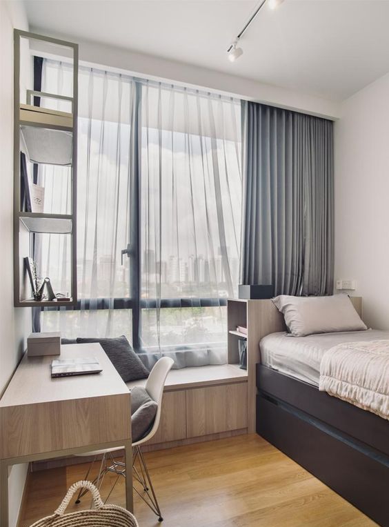 a contemporary teen room with a storage bed, a windowsill seat, a matching desk and a shelf on the wall