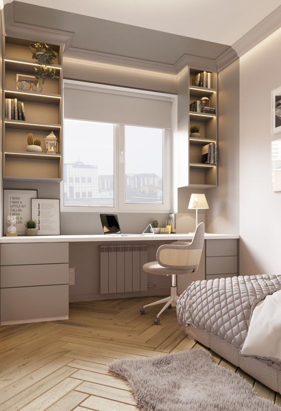 a stylish neutral teen bedroom with an upholstered bed, a study space by the window including drawers and open storage compartments plus a chair