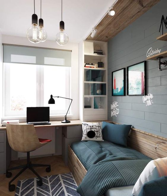 an industrial teen room with a faux brick wall, wooden touches, a bed, a built-in desk and a storage shelf plus bulbs