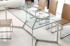 a chic and edgy dining table with a metal framing and a glass tabletop looks amazing