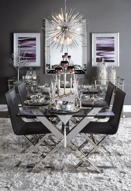 a chic table with criss cross metal legs and matching chairs in black for a dramatic dining space