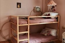 a shared girl’s bedroom with an IKEA Kura bed
