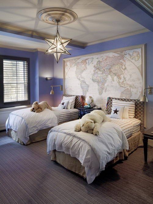 a nautical travel kids' room with a map, blue walls and a cool star chandelier will easily fit both girls and boys