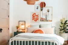 a bright and fun mid-century modern teen bedroom with a white bed and pastel bedding, woven stools, a woven pendant lamp and artwork