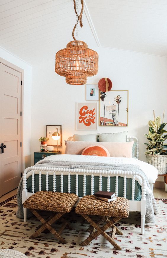 a bright and fun mid-century modern teen bedroom with a white bed and pastel bedding, woven stools, a woven pendant lamp and artwork