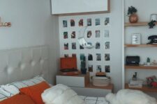 a chic teen room with a neutral bed, some storage units, lights, a gallery wall and floating shelves plus bright bedding