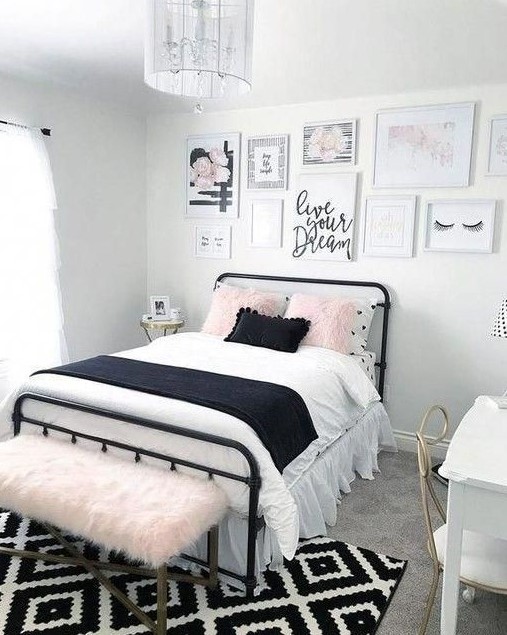 a girlish teen bedroom in black, white and blush, with a cool gallery wall, printed textiles and touches of brass