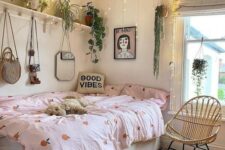 a pretty teen room with a storage bed, a shelf with lots of potted plants and lights hanging over the bed, pretty bedding and art