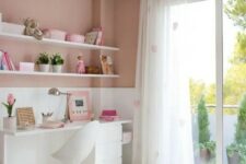 a romantic dusty, blush pink and white bedroom with pink bedding, heart printed curtains and simple white furniture