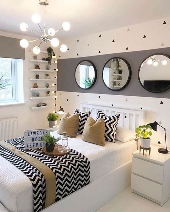 a stylish and playful teen girl bedroom in white, grey and black, with tan touches, geometric prints and greenery