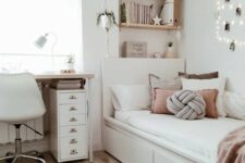 a stylish modern teen girl bedroom in neutrals, with dusty pink touches, lights, a jute rug and potted greenery