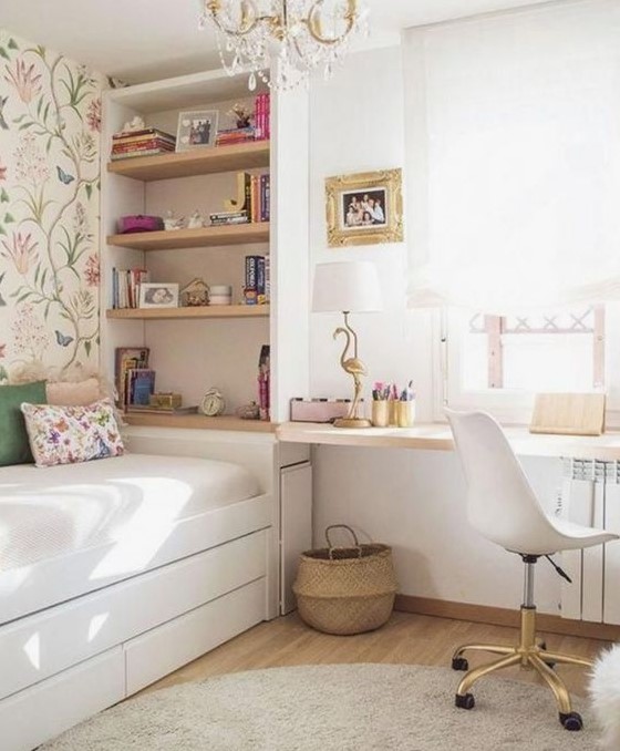 an airy teen girl bedroom with flroal wallpaper, a crystal chandelier, hot pink and gold touches is lovely