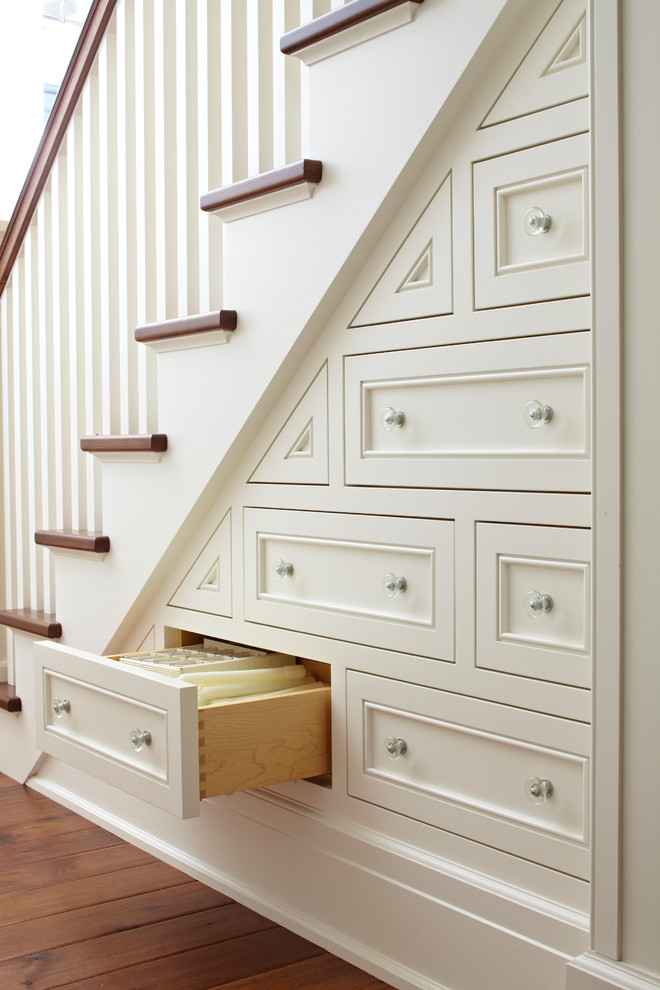 Here is an example of how cute under-stairs drawer system could be.
