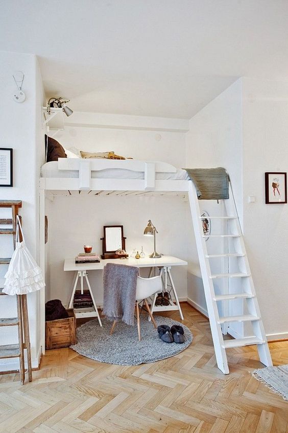 a light-filled contemporary teen bedroom with a working space below and a sleeping one above