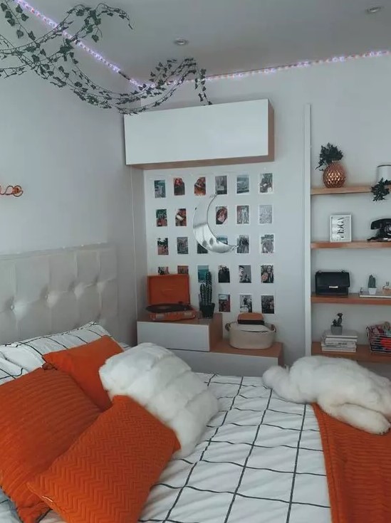 a chic teen room with a neutral bed, some storage units, lights, a gallery wall and floating shelves plus bright bedding