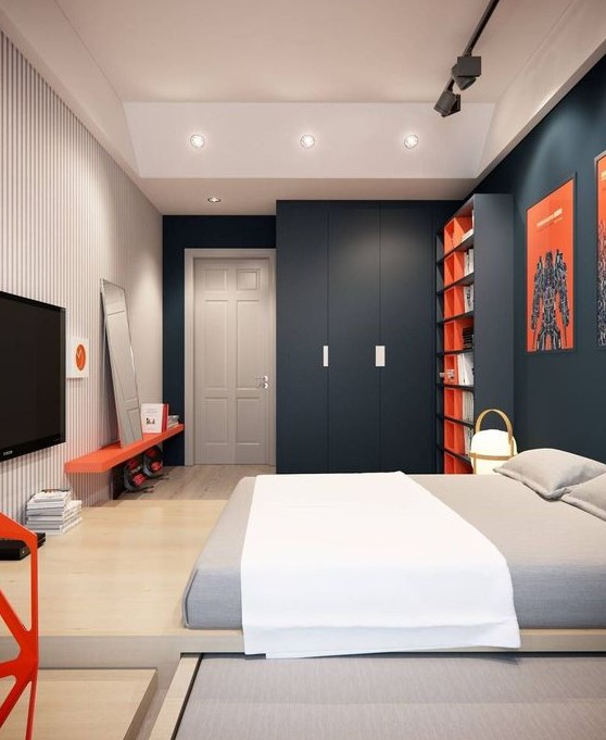 a clean minimalist or contemporary teenage bedroom with charcoal walls, a striped one, a platform bed, bright red touches