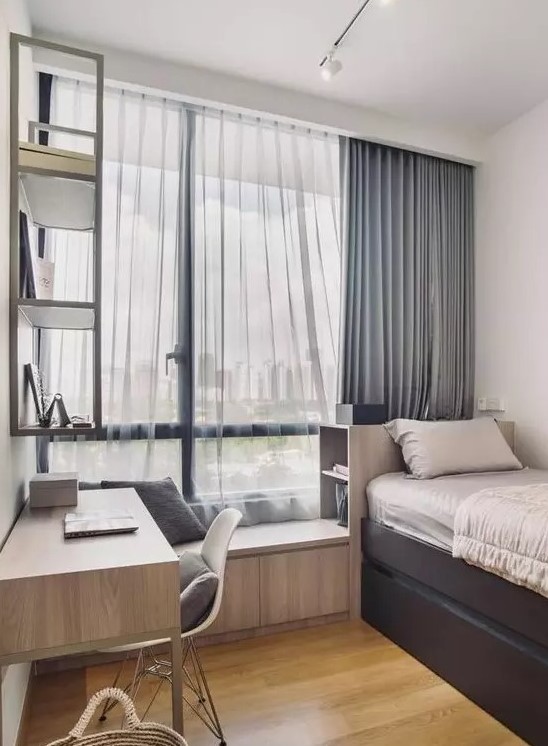 a contemporary teen room with a storage bed, a windowsill seat, a matching desk and a shelf on the wall