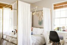 a cool teen room with a large canopy bed with lights, a white desk, a black chair and shades is a pretty space