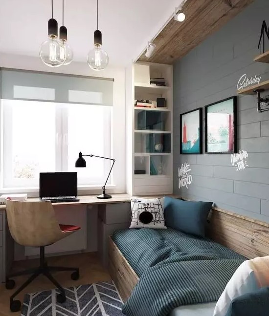 an industrial teen room with a faux brick wall, wooden touches, a bed, a built-in desk and a storage shelf plus bulbs