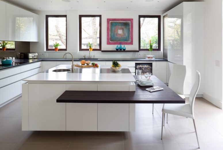 a handless kitchen island with an interesting dining area solution where you can use standard kitchen chairs