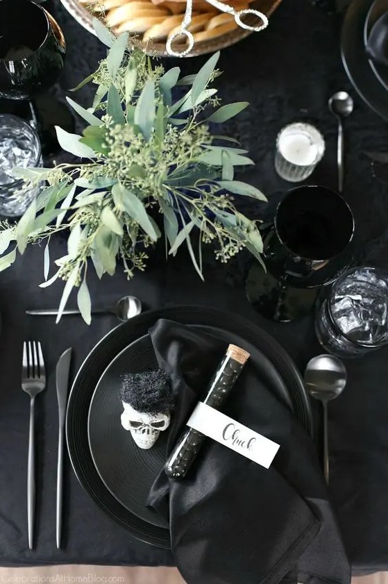 a simple seeded eucalyptus centerpiece will add life to your black tablescape and make it feel cooler