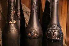 black wine bottles with eyes, skulls and trees are spooky and scary Halloween decoration for any space