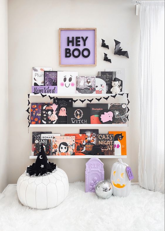 bold Halloween ledges with Halloween books and artwork, bats and an artwork is a cool idea for styling a kids' room