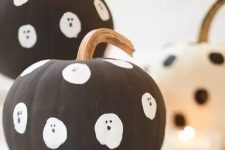 make some easy matte black pumpkins with ghosts for your kids’ Halloween party