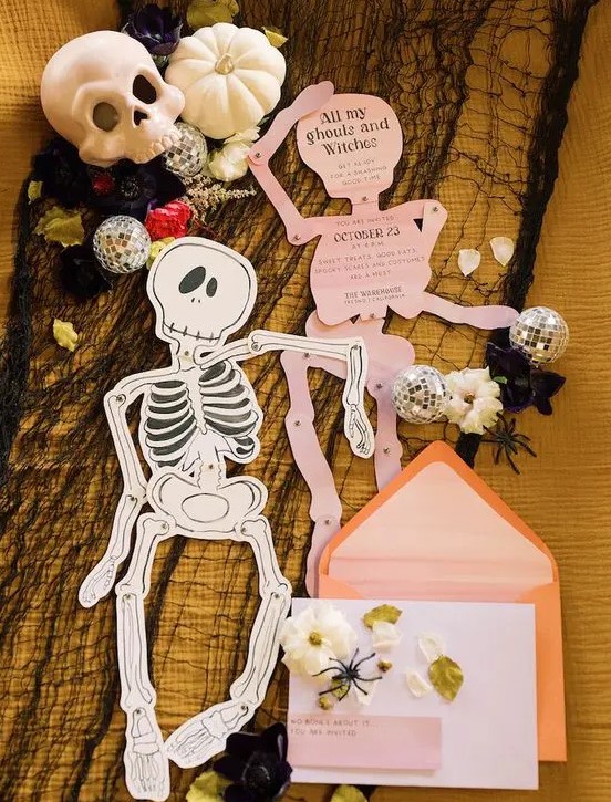 skeleton-shaped invitations in pink andorange envelopes will be afun and cool idea for both a kids' and adults' party