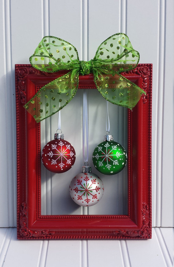 A vIntage picture frame painted in glossy red with a bow and a bunch of ball ornaments hanging in it would become a perfect Christmas wreath.