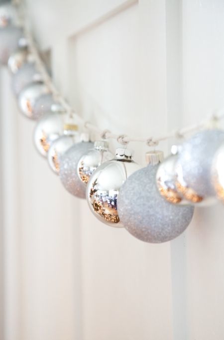 a Christmas garland of silver and silver glitter ornaments is a cool decoration for the holidays