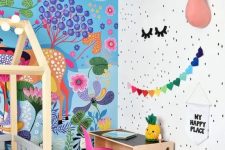 a beautiful and bold kid’s room with a bright painted wall, faux taxidermy, bold garlands and toys and a hot pink chair