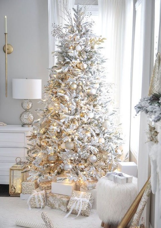 Flocked white Christmas tree with all white and silver decorations