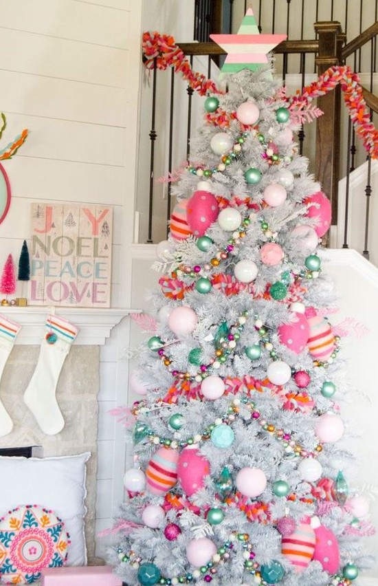 a bright and fun Christmas silver tree with pink, hot pink and green ornaments, beads and striped ornaments and stars