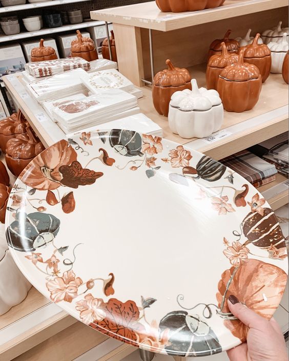 a creative pumpkin and leaf print plate in orange, brown and grey is a lovely idea for Thanksgiving, it will accent your food