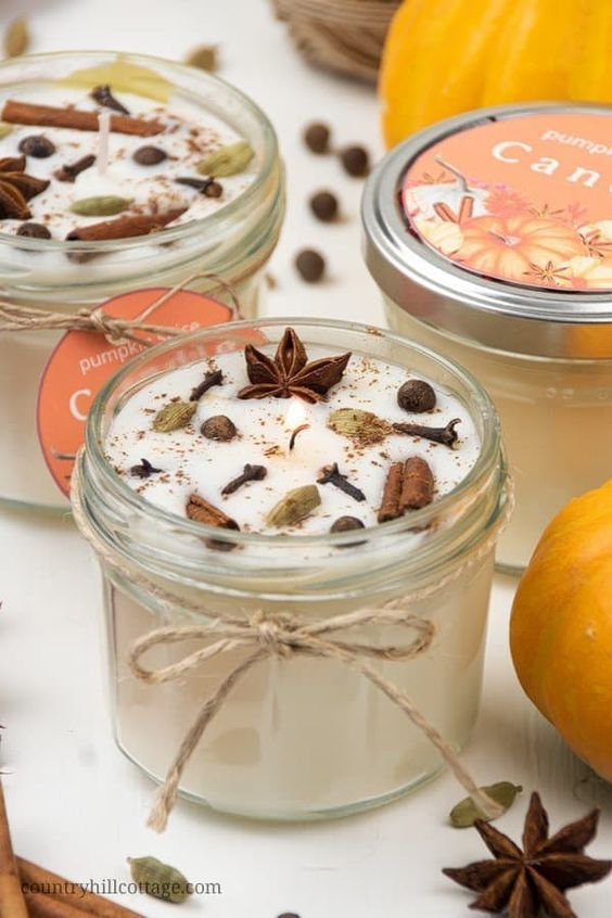 a fall scented candle with lots of various stuff can be a nice party favor or decor for Thanksgiving