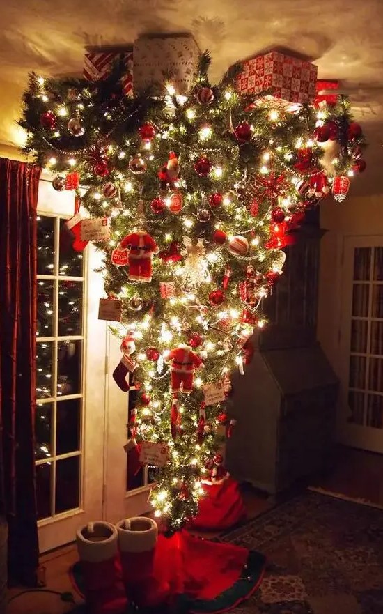 a jaw-dropping upside down Christmas tree with silver and red ornaments, letters, beaded garlands and little Santa Claus figurines