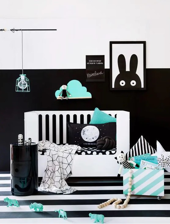 a partly black and white wall makes a bold accent and mint touches make the room fresher