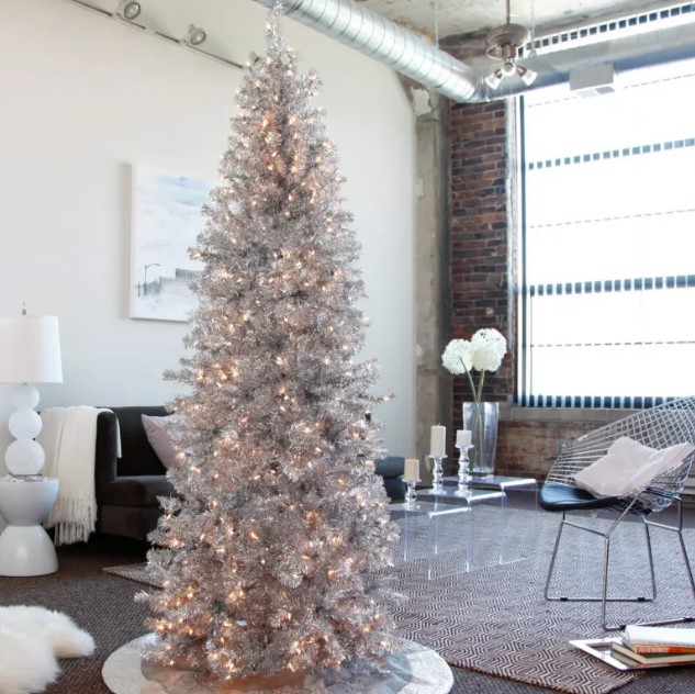 a tall shiny silver tree will perfecly fit a modern space, just add some lights for a sparkling look