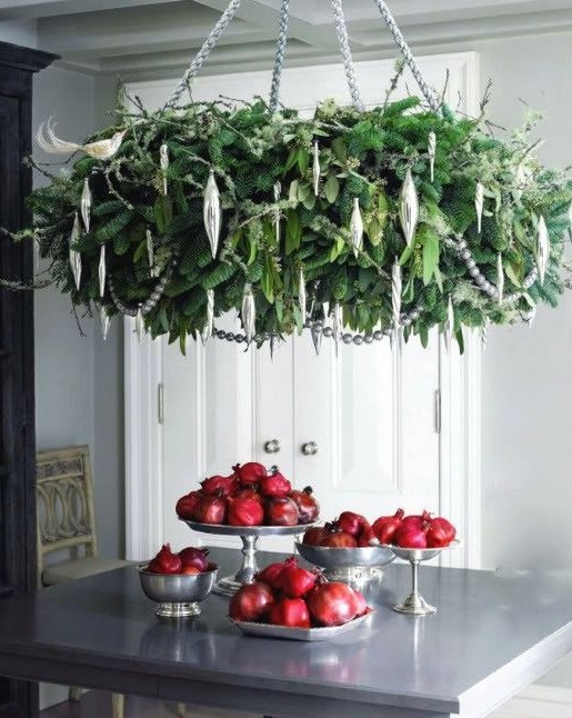 an oversized green chandelier and silver ornaments will make a statement in your kitchen or any other holiday space