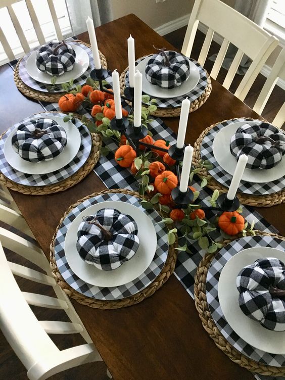 buffalo check plates, white ones and woven placemats for a modern farmhouse Thanksgiving table with bold touches