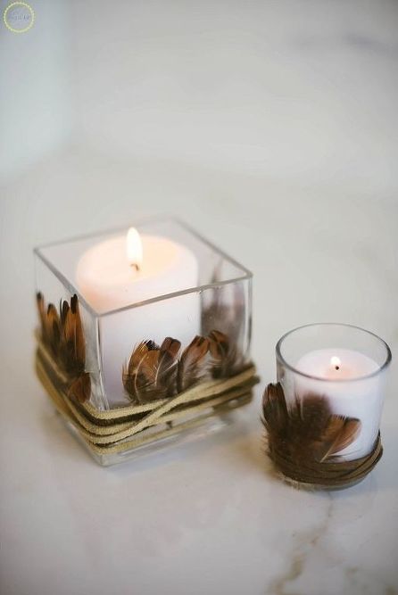 candles in glasses wrapped with feathers and leather cord will easily give your fall or Thanksgiving a boho feel