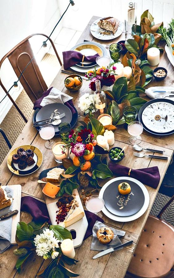 matte black and white plates paired with white and black printed ones and purple napkins for a bright Thanksgiving tablescape