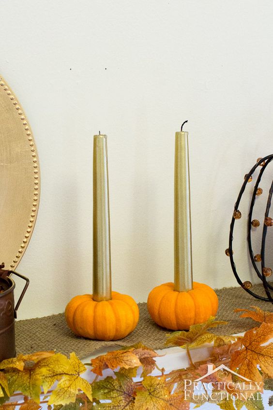 mini faux pumpkins with gold candles are a cool last minute craft that will give a fall feel to the space