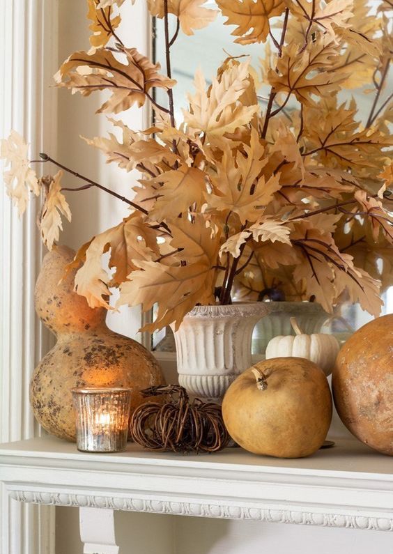 natural pumpkins and gourds, candles and fall leaves are amazing for fall and Thanksgiving decor
