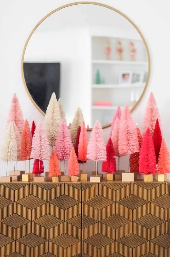 style your elegant console table with white, blush, pink, coral and hot red bottle brush Christmas tree for a bold look