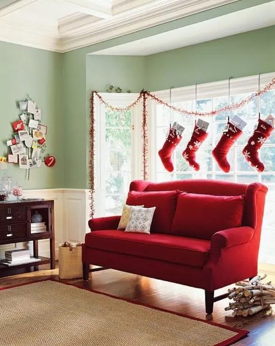 traditional red and white Christmas stockings hanging over the window is a creative way to style your space for Christmas